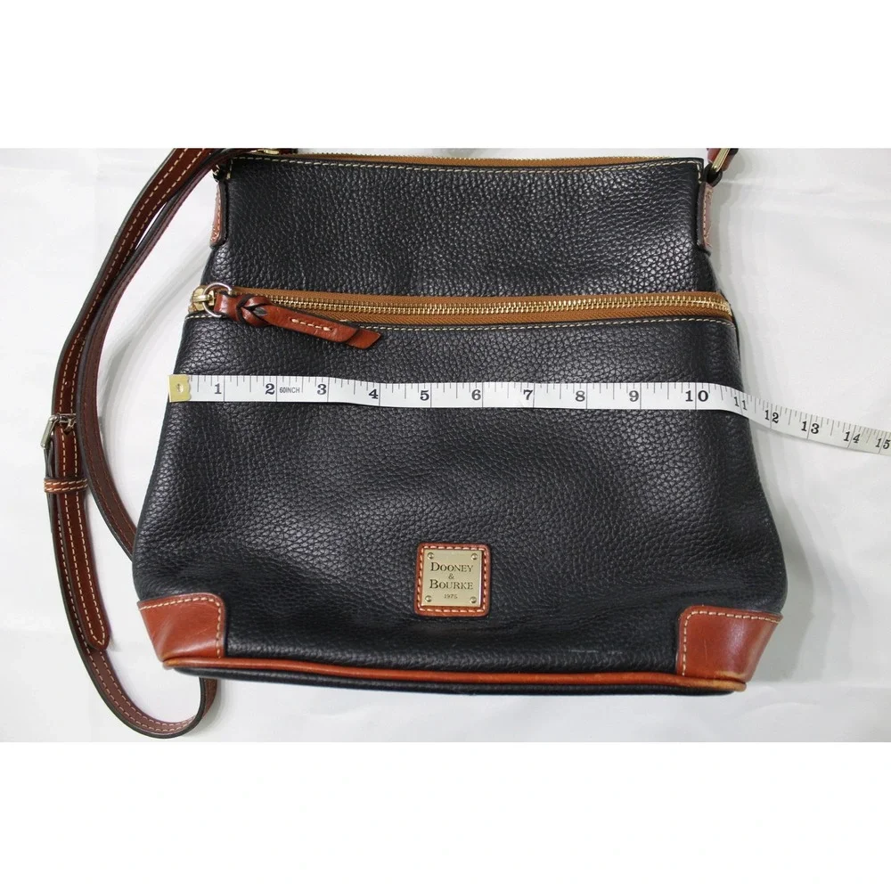 Dooney & Bourke Black Pebbled Leather Crossbody Bag with Tan Trim and Red Lining